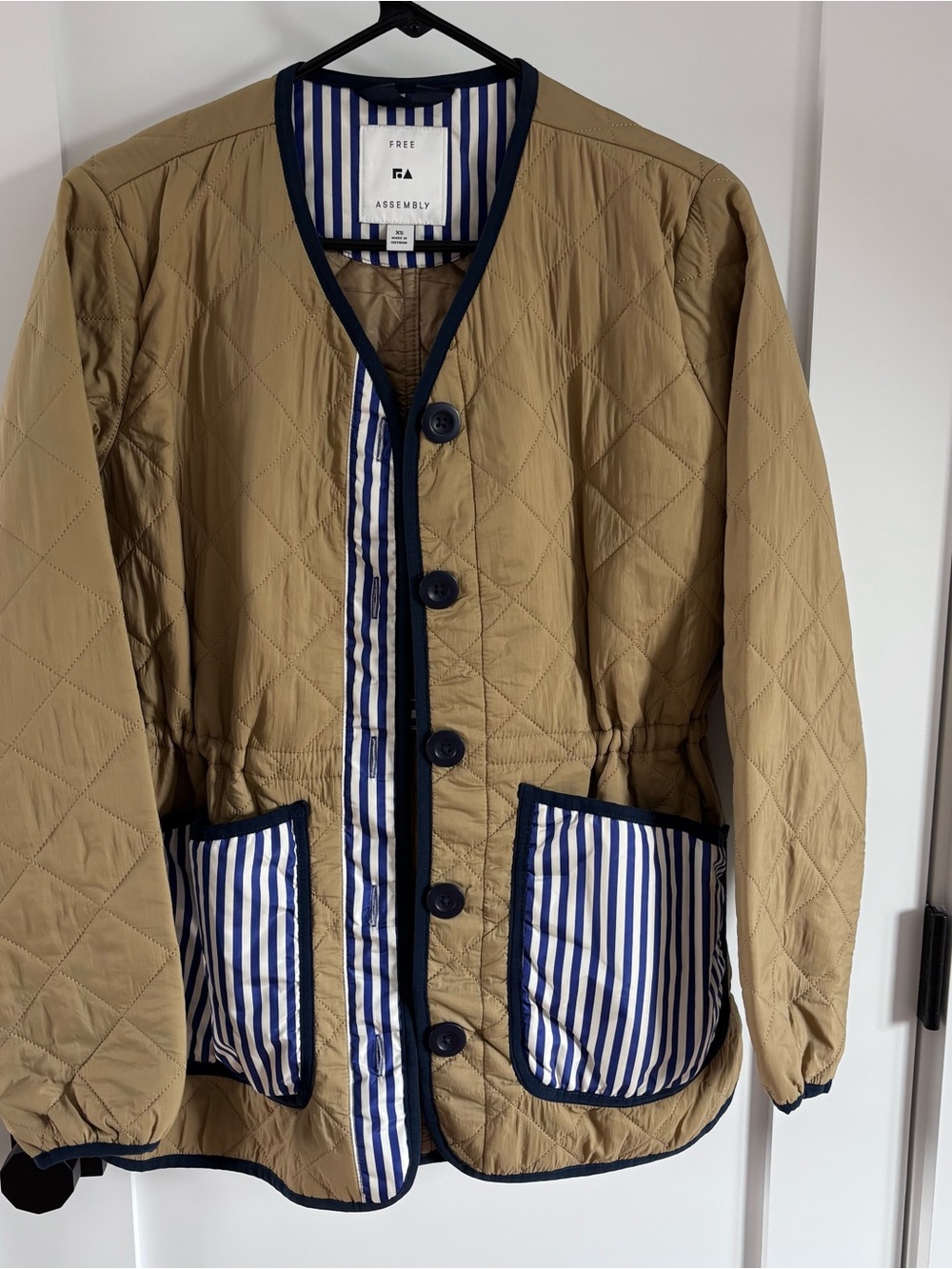 Quilted Tan Jacket with Navy Trim